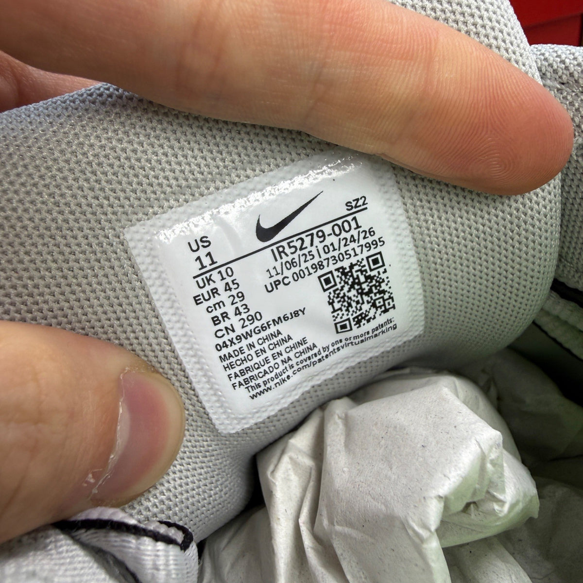 Nike athletic shoes grey with black and volt accents, mesh upper and logo detail.