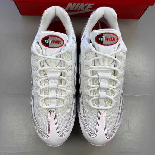 Nike trainers white with red accents and big bubble sole design.