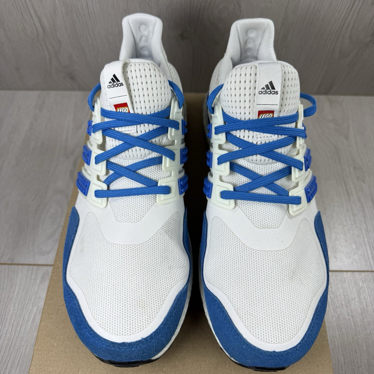 Adidas grey Ultra Boost trainers with blue accents and distinctive LEGO branding.