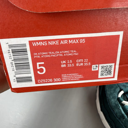 Nike Air Max 95 green velvet trainers with teal accents and white sole.