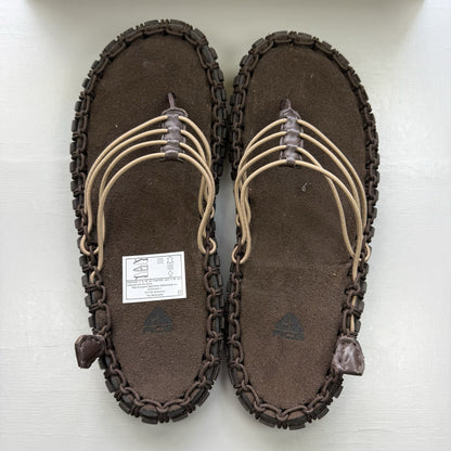 Nike ACG Valkyrie CI slides dark cinder brown with logo detail and textured material.