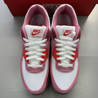 Nike Air Max 90 trainers white with peony and light crimson accents, classic logo.