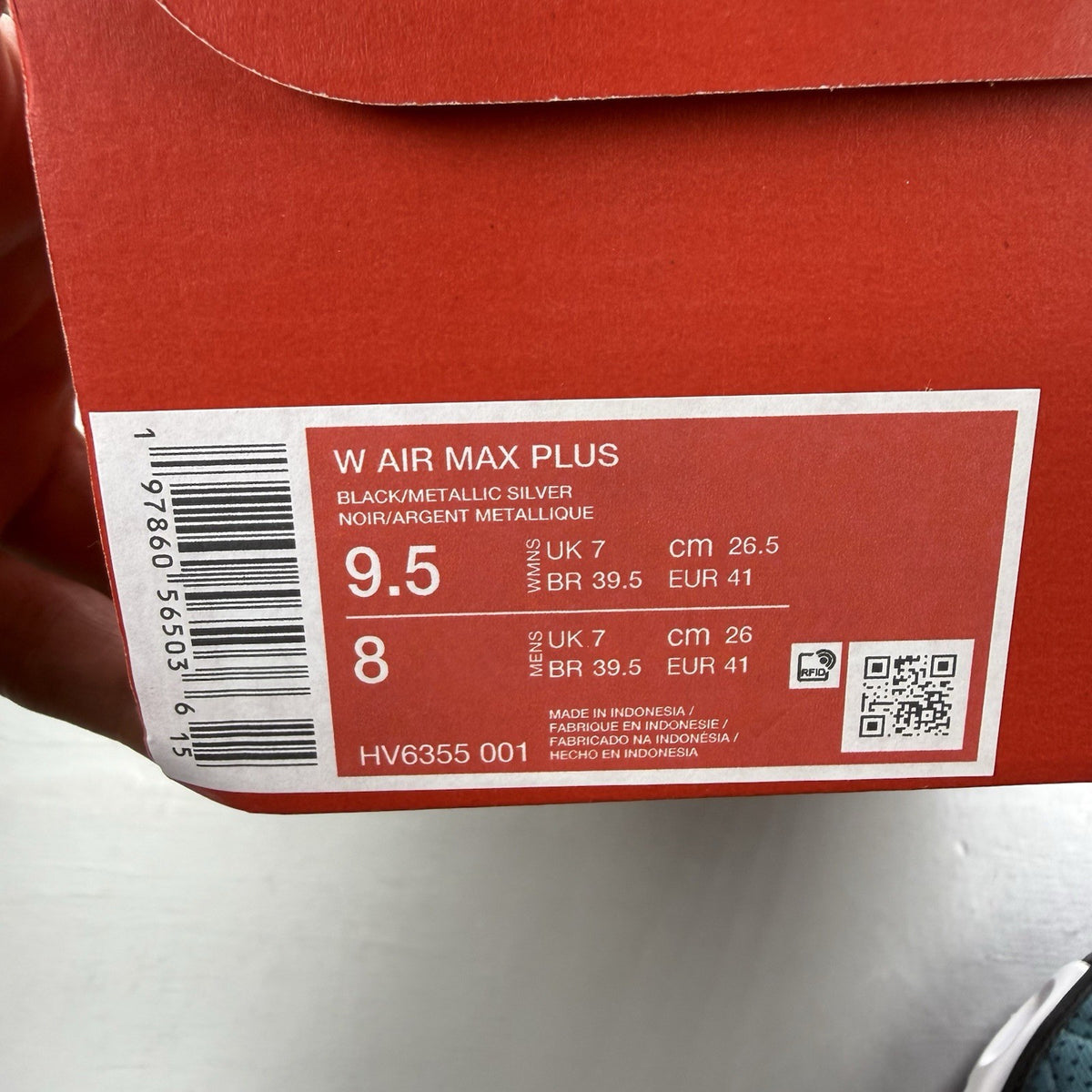 Nike Air Max Plus TN black with dusty cactus dot pattern and signature logo.