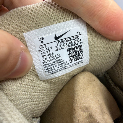 Nike Air Max 95 beige trainers with desert khaki accents and logo detailing.