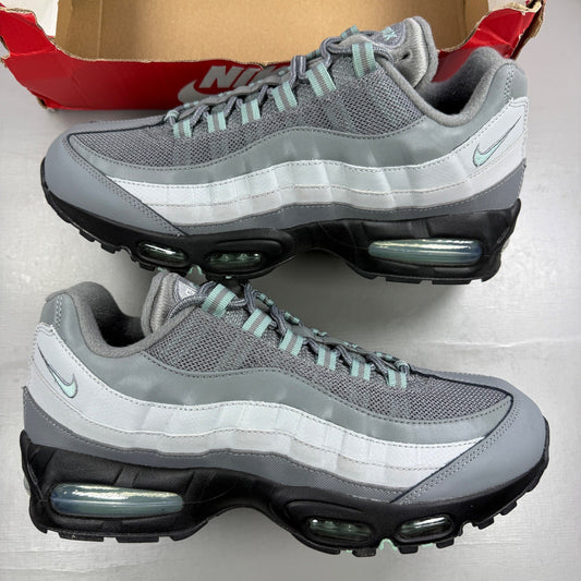 Nike running shoes grey with big bubble sole and logo detailing.