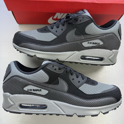 Nike Air Max 90 black trainers with grey accents and iconic logo detail.