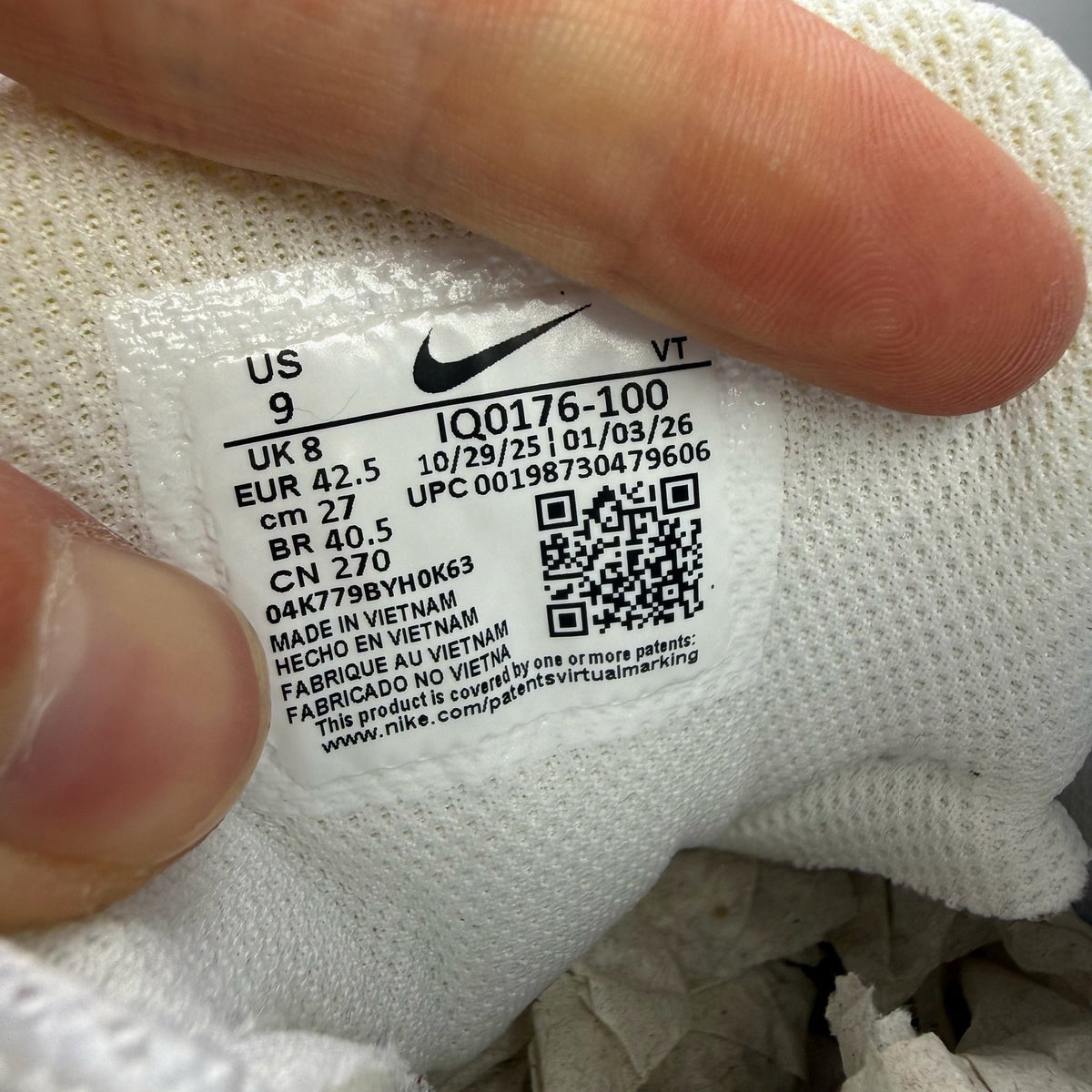 Nike Air Max 95 white sneakers with signature big bubble sole and logo detail.