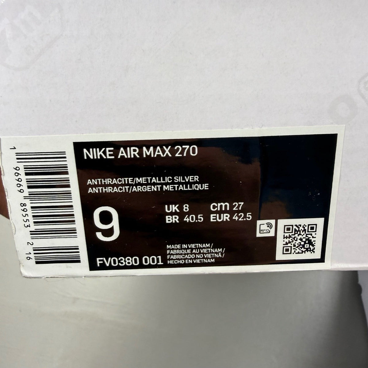 Nike Air Max 270 grey sneakers with anthracite and industrial blue accents.