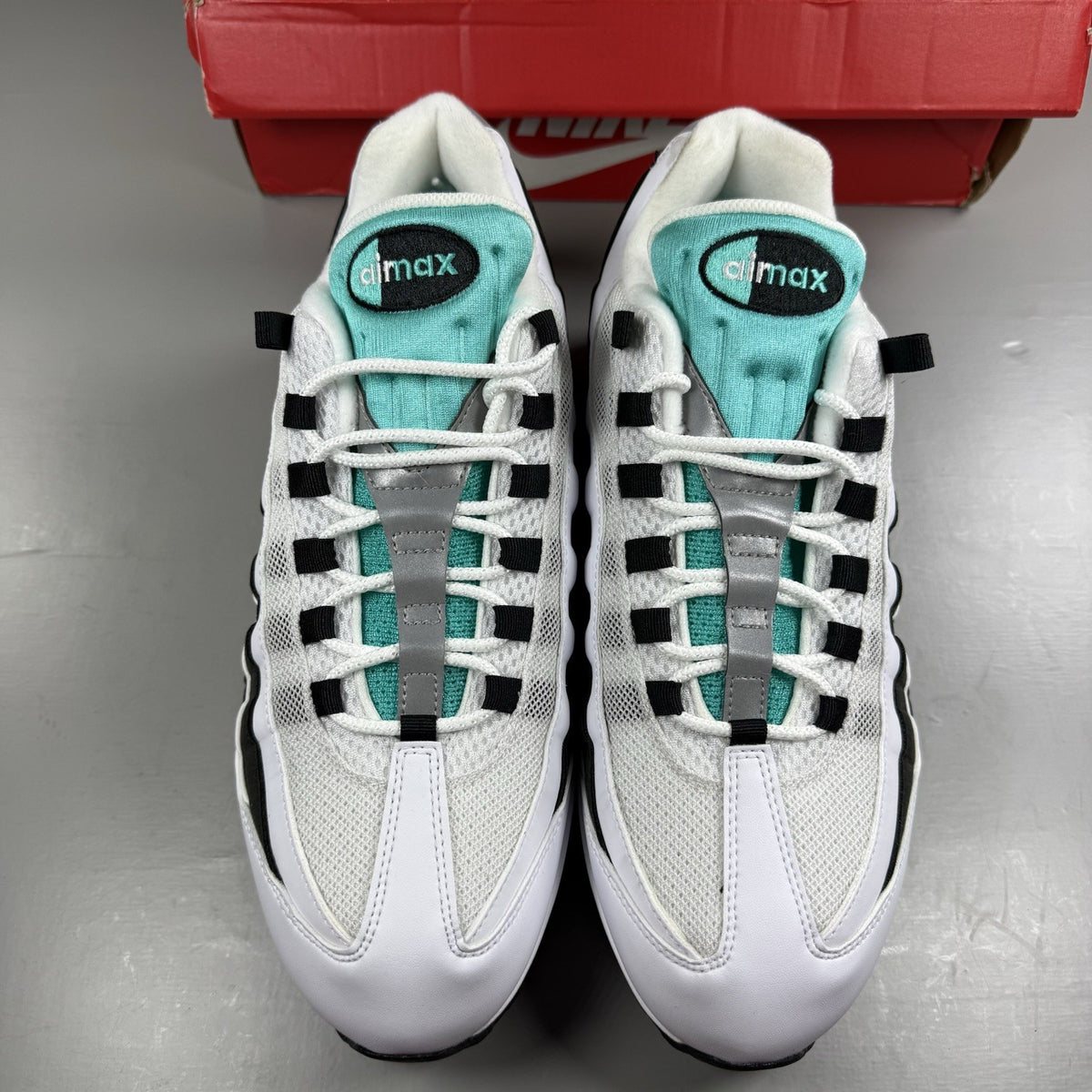 Nike Air Max 95 OG trainers white with black accents and signature bubble sole design.