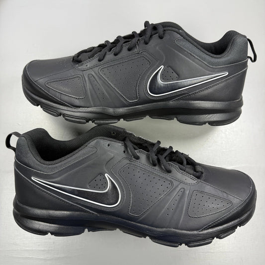Nike black trainers metallic silver accents lace-up design with logo detail.