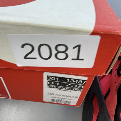Nike Air Huarache trainers red and black with distinctive logo and unique design details.