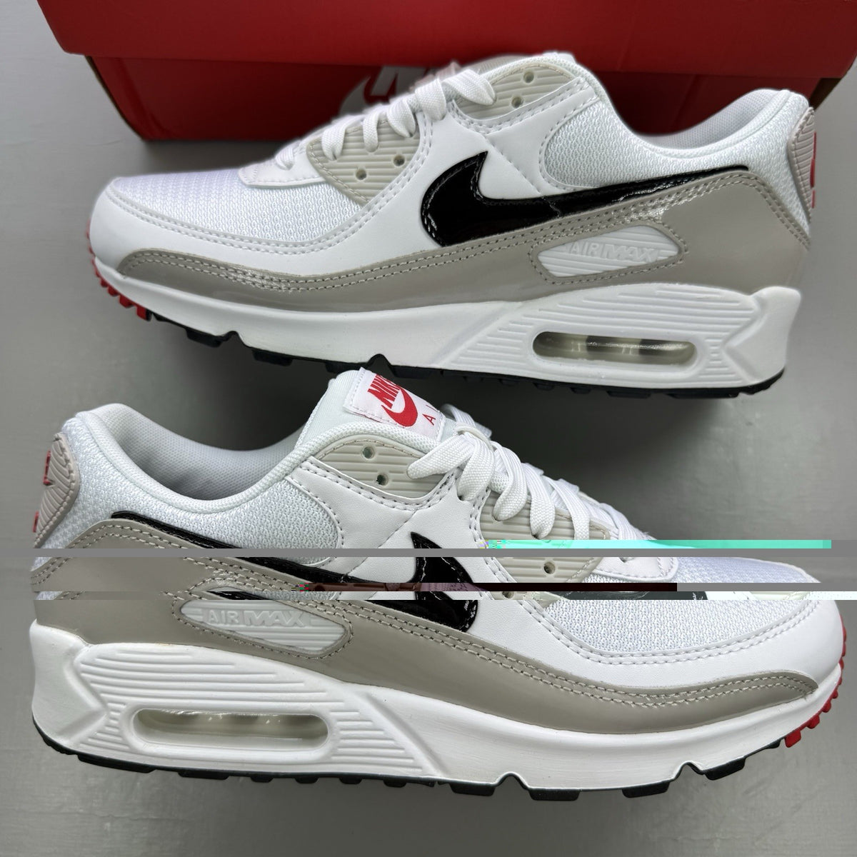 Nike Air Max 90 white trainers with black and red accents, featuring iconic logo and design.