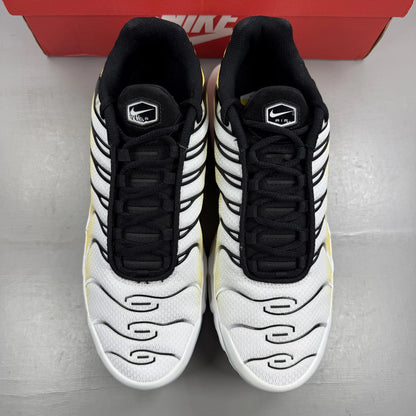 Nike Air Max Plus TN white with varsity maize yellow accents and signature logo.
