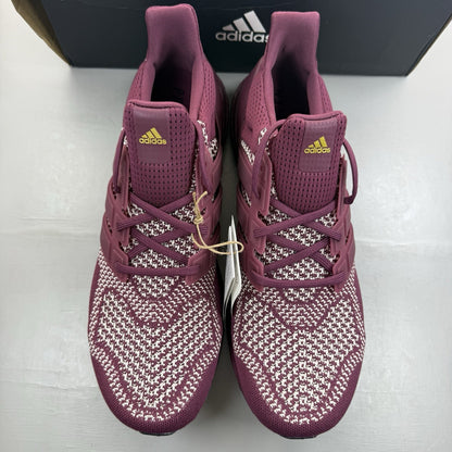 Adidas UltraBoost 1.0 DNA red trainers with signature three stripes and knit upper.