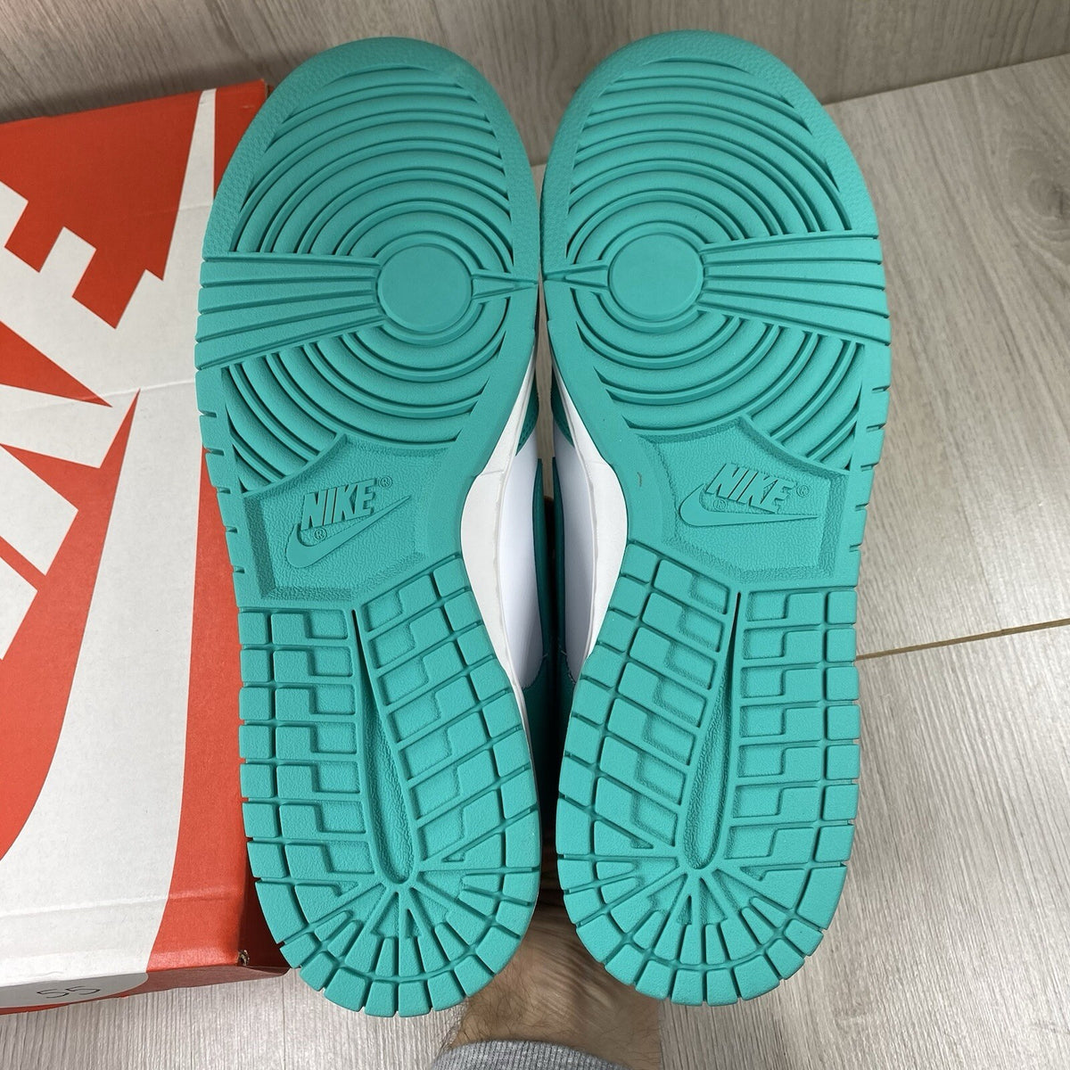 Nike Dunk Low trainers white with clear jade accents and signature swoosh logo.