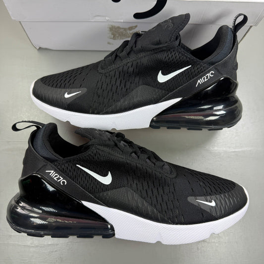 Nike Air Max 270 black running trainers with white accents and logo detail.