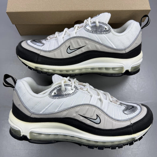 Nike Air Max 98 white trainers with silver accents and textured mesh upper.