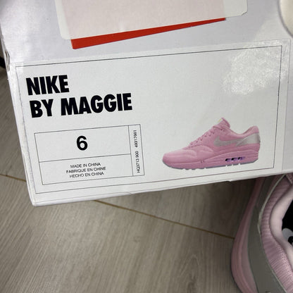 Nike Air Max 1 trainers pink with silver accents and unique design details.