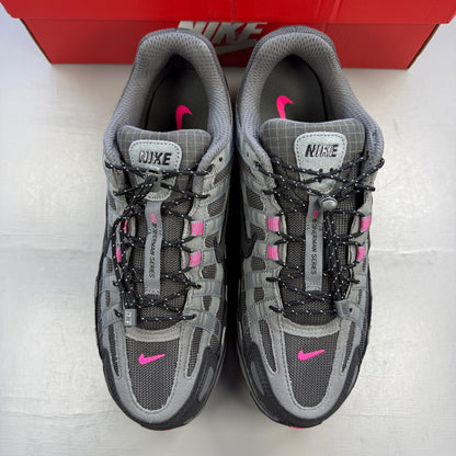 Nike P-6000 trainers grey with pink and black accents, mesh material, logo on tongue.