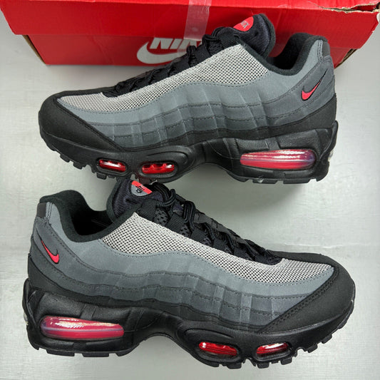 Nike deck shoes black with bright crimson accents and signature logo details.