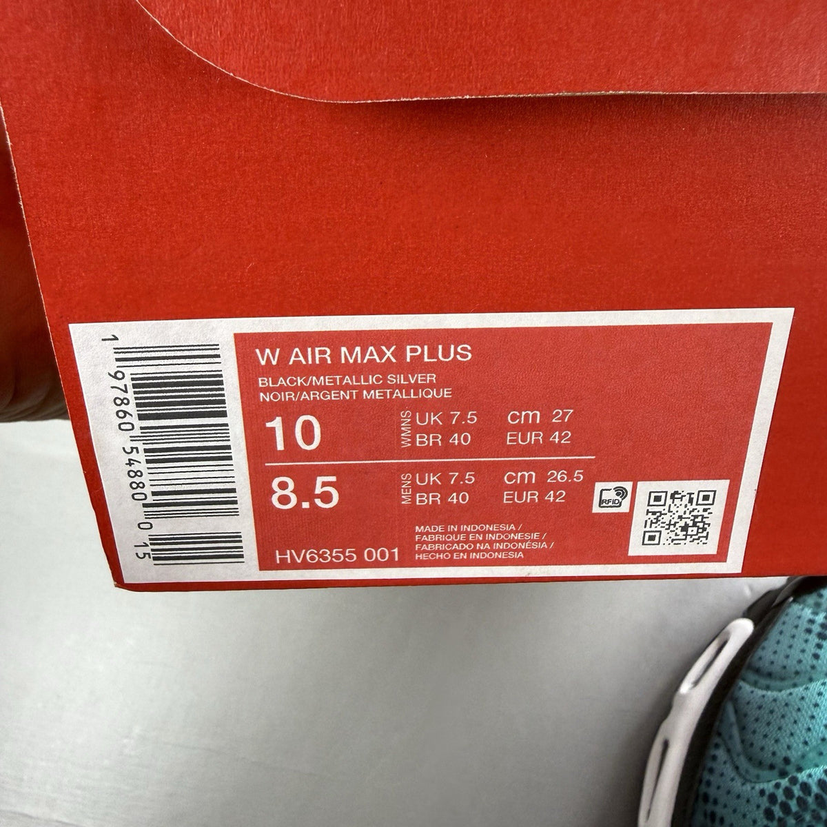 Nike Air Max Plus TN black with dusty cactus dot pattern and signature logo.