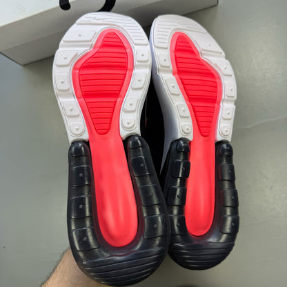Nike black Air Max 270 trainers with white accents and logo detail.