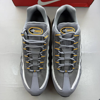 Nike Air Max 95 grey trainers with sundial accents and signature logo details.