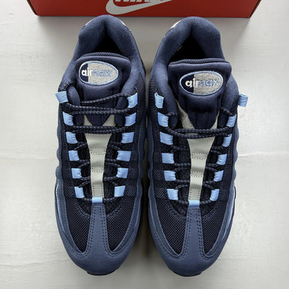 Nike Air Max 95 blue trainers with big bubble sole and branded logo details.