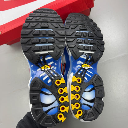 Nike trainers white with signal blue accents and distinctive Air Max Plus design.