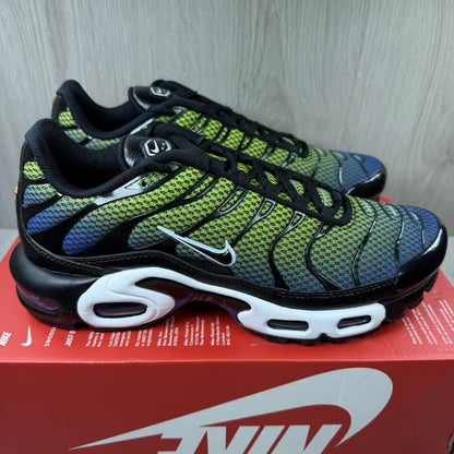 Nike Air Max Plus TN trainers black with racer blue and volt accents, mesh material.