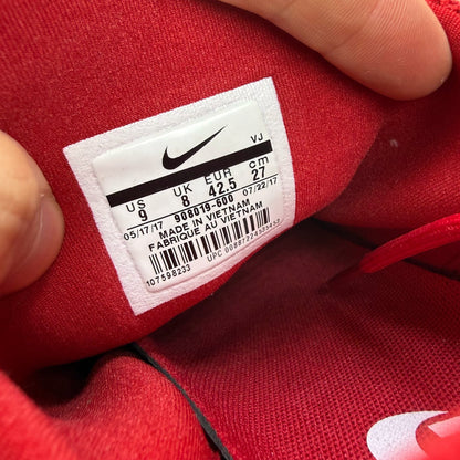 Nike Presto Fly red trainers with white accents and logo detail.