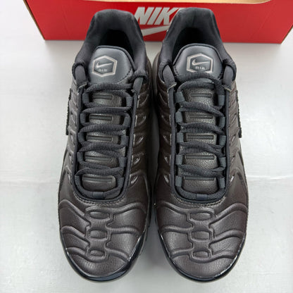 Nike Air Max Plus TN Premium black trainers with signature logo and sleek design.