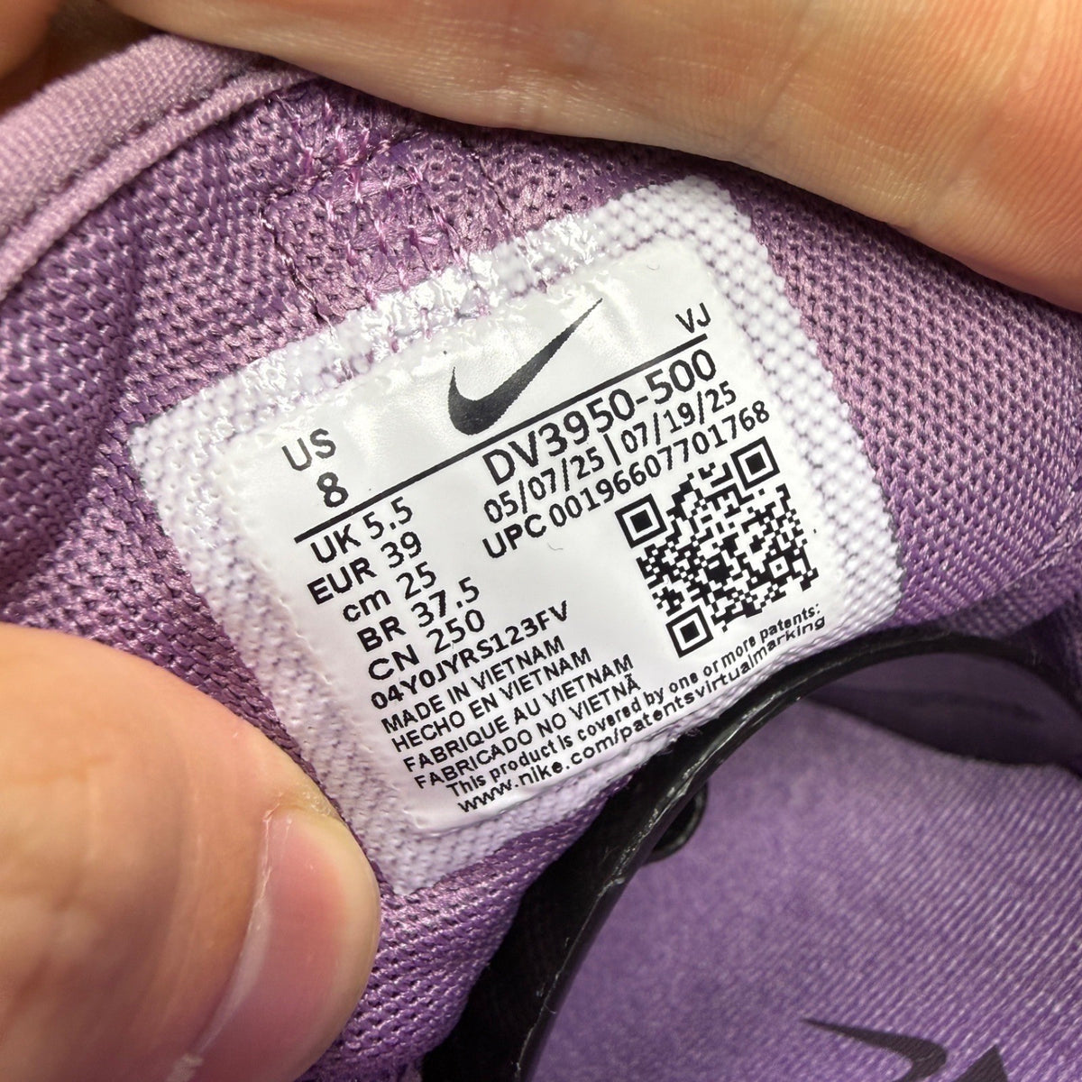 Nike Free Metcon 5 purple trainers with mesh upper and logo detail.
