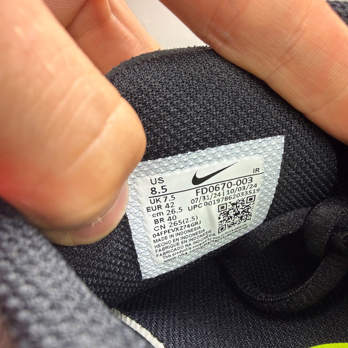 Nike Air Max Plus TN black grey volt with signature logo and sleek design.