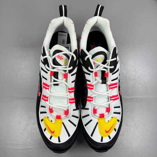 Nike Air Max 98 white trainers with black and yellow accents, featuring a sleek design.