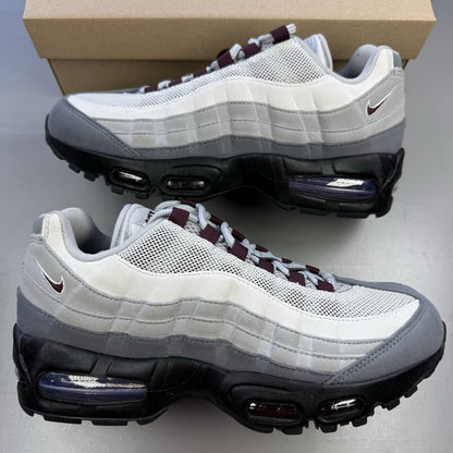 Nike Air Max 95 OG Big Bubble grey sneakers with burgundy accents and visible air cushioning.