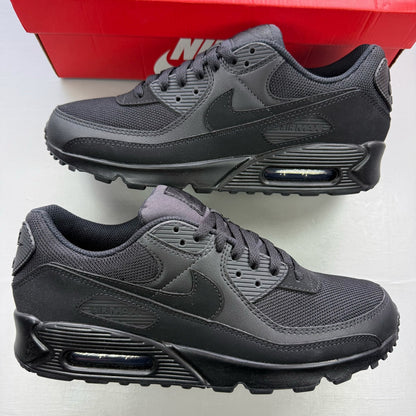 Nike Air Max 90 trainers black with sleek design and iconic logo.