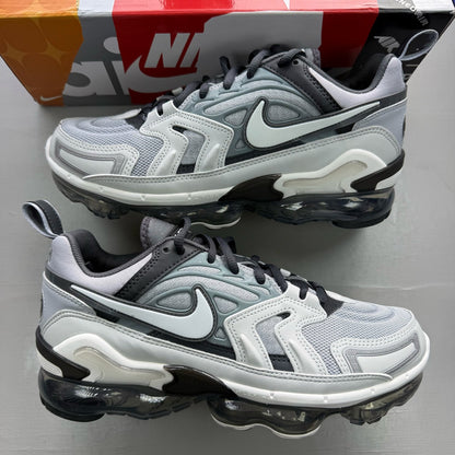 Nike grey trainers with Air cushioning, sleek design, and logo detail.