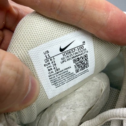 Nike Air Max Plus TN white trainers with signature logo and textured detailing.