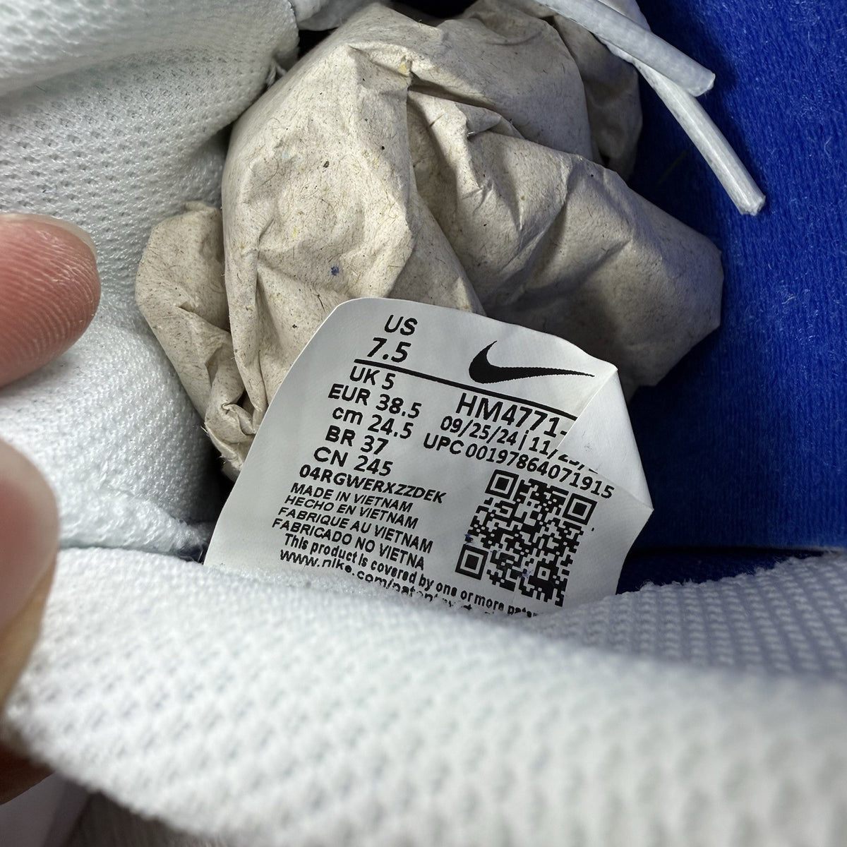 Nike blue trainers with white swoosh logo and mesh upper details.