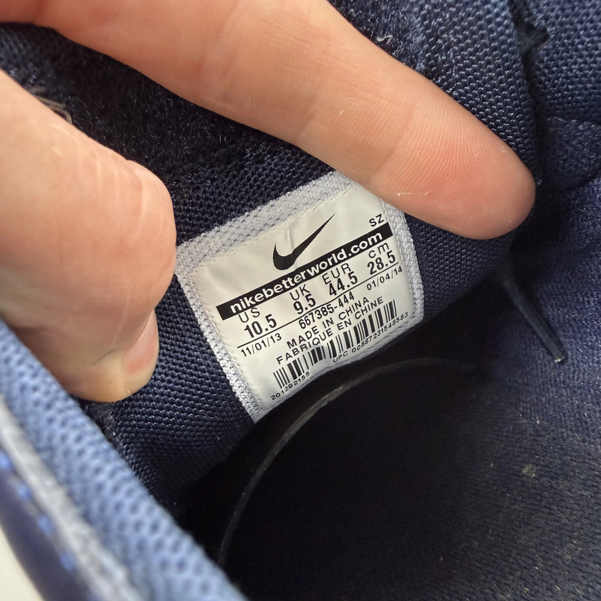 Nike blue trainers with obsidian camo pattern and logo detail.