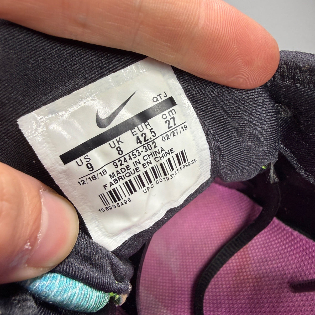 Nike athletic shoes Aurora Green with black accents and signature logo details.