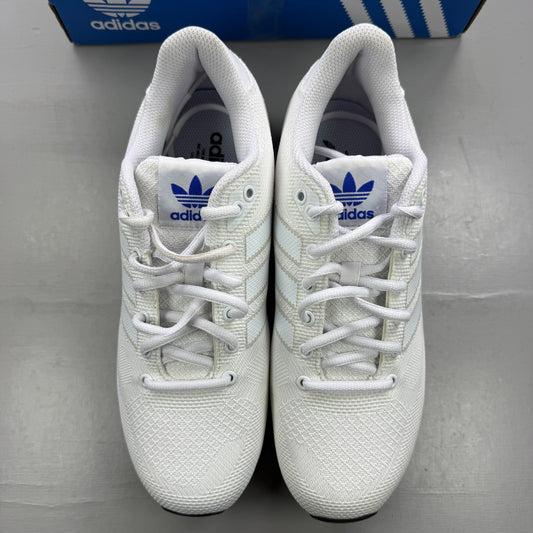 Adidas white trainers with blue accents and logo detailing on the side.