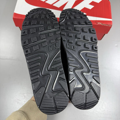 Nike Air Max 90 Recraft black trainers with textured upper and signature swoosh logo.