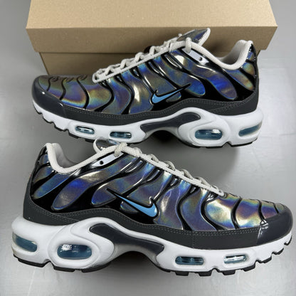 Nike Air Max Plus TN trainers white iridescent finish with signature swoosh logo.