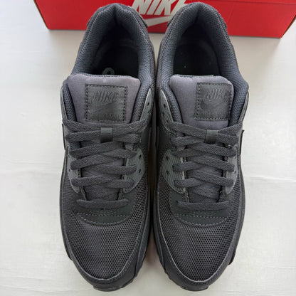 Nike Air Max 90 trainers black with sleek design and iconic logo.