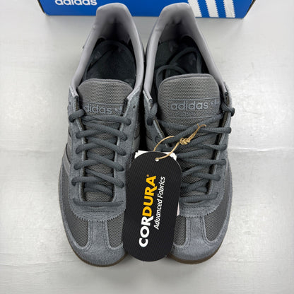 Adidas athletic shoes grey Cordura material with gum sole and logo detail.