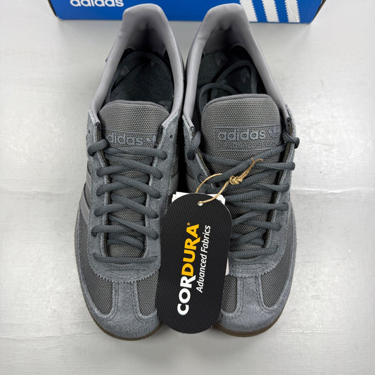 Adidas athletic shoes grey Cordura material with gum sole and logo detail.