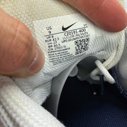 Nike Air Max 95 trainers white with navy and yellow accents, featuring logo on tongue.