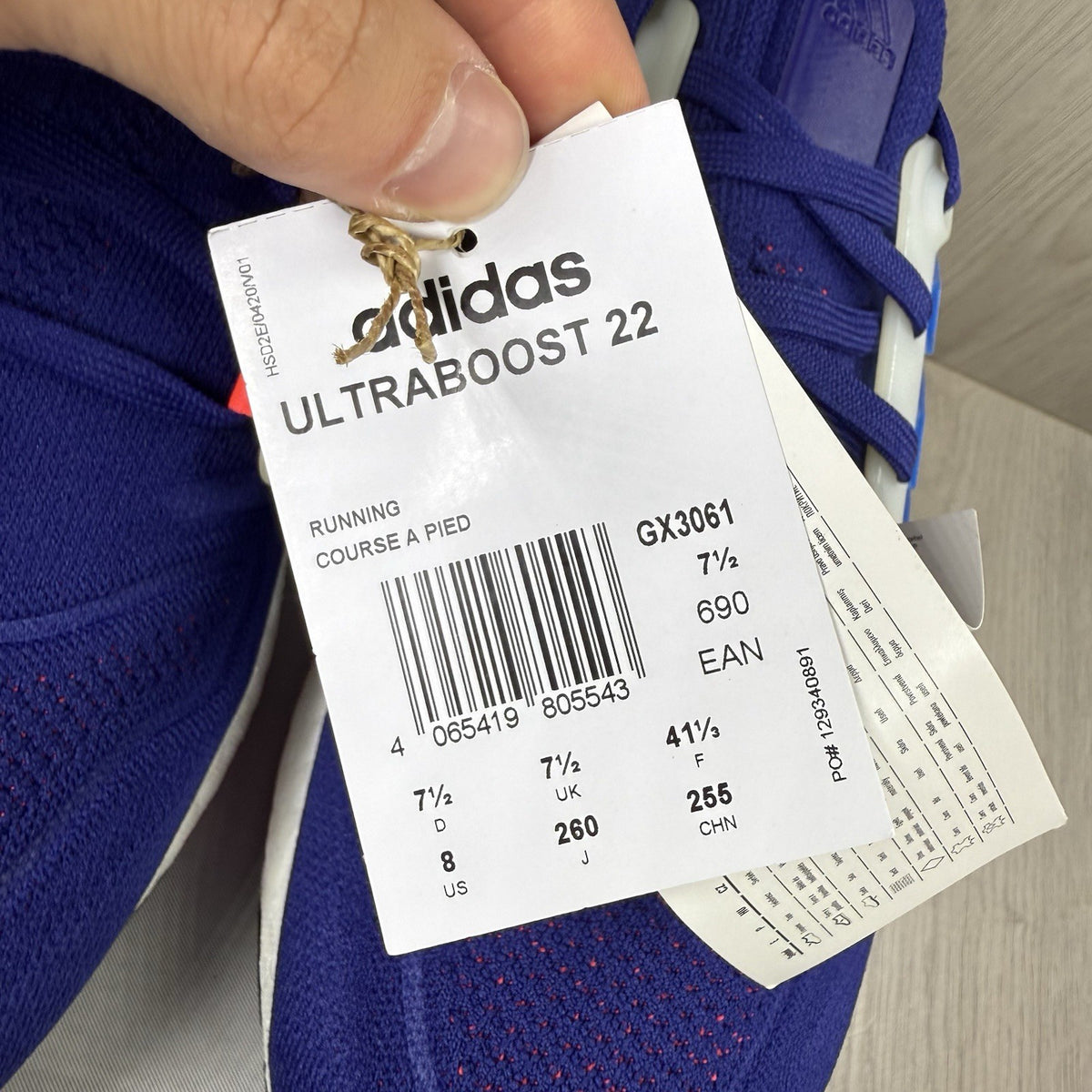 Adidas Ultra Boost 22 trainers in legacy indigo with turbo blue and white accents.